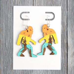 Bigfoot Sunset Forest Wood Earrings. These earrings are made with 1/8″ thickness basswood. These earrings are lightweight and hand painted.