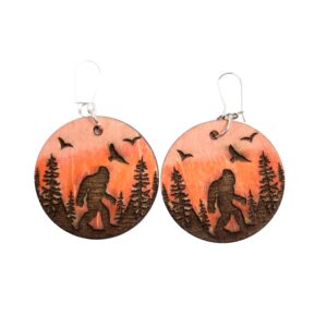 Bigfoot Sunset Scenery Wood Earrings. These earrings are made with 1/8″ thickness basswood. These earrings are lightweight and hand painted. They are not sealed to keep a rustic look and feel.