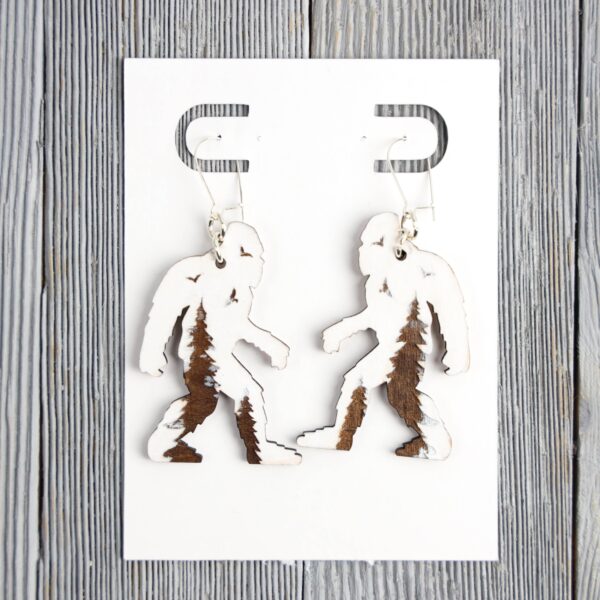 Bigfoot White Forest Wood Earrings. These earrings are made with 1/8″ thickness basswood. These earrings are lightweight and hand painted.