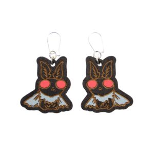 Mothman Wood Earrings. These earrings are made with 1/8″ thickness basswood. These earrings are lightweight and hand painted. They are not sealed to keep a rustic look and feel.