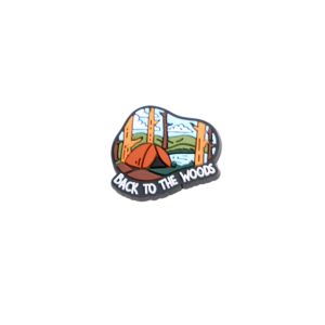 Back to the woods shoe charm with trees, orange tent, green hills, and blue sky.