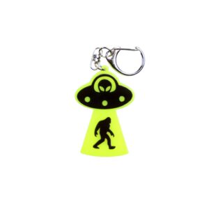 Bigfoot abduction neon yellow bag tag with black ship and black backing.