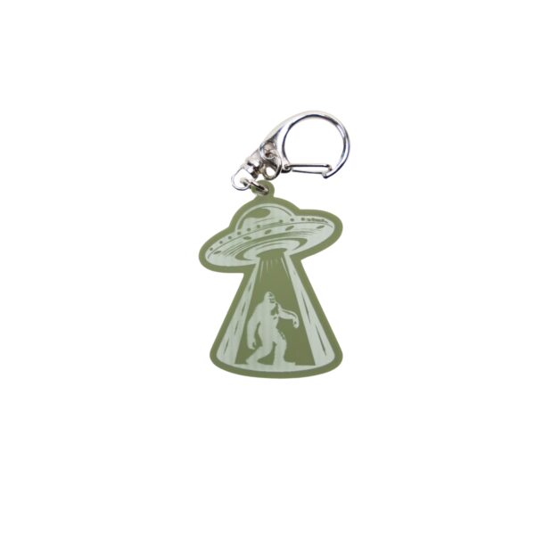 Bigfoot alien abduction green bag tag with spaceship.