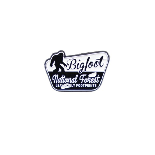 Bigfoot national forest leave only footprints enamel pin in black and white.