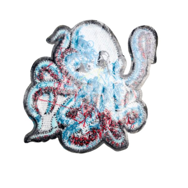 Kraken patch in a turquoise blue and maroon. 