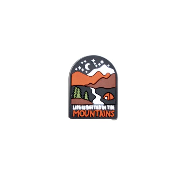 Life is better in the mountains shoe charm with brown mountains and gray starry sky.