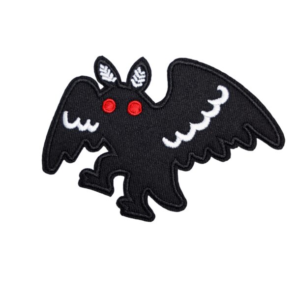 Mothman walking patch in white and black with red eyes.