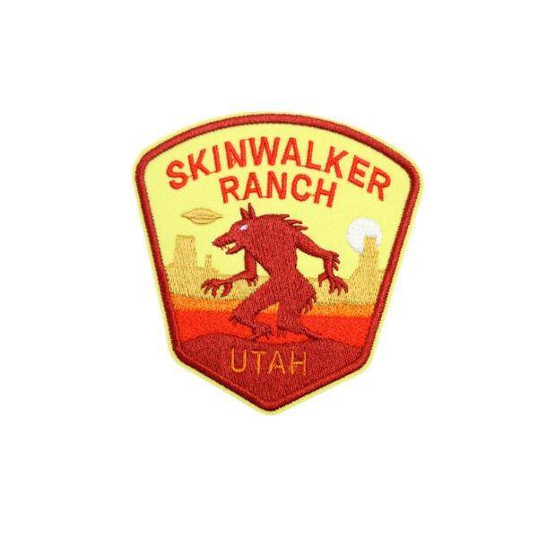 Utah Skinwalker patch with yellow and orange with a desert backdrop.