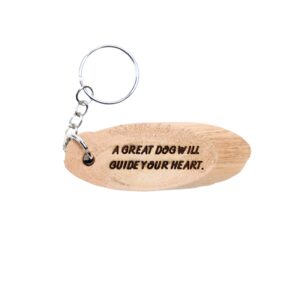 Call Of The Wild Driftwood Keychain. “A great dog will guide your heart.” front quote and Yukon filming location of Cal Of The Wild longitude and latitude “64.2823° N 135.0000° W” on the back.