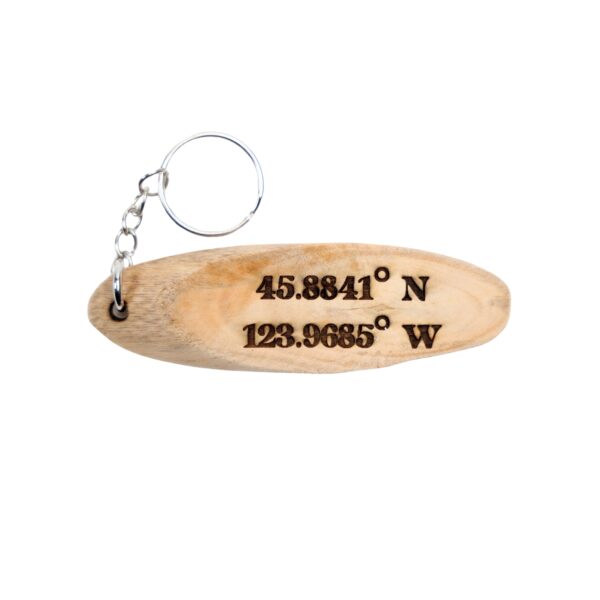 Goonies Driftwood Keychain. “It's our time down here.” front quote and Haystack Rock, OR filming location of Goonies longitude and latitude “45.8841° N, 123.9685° W” on the back.