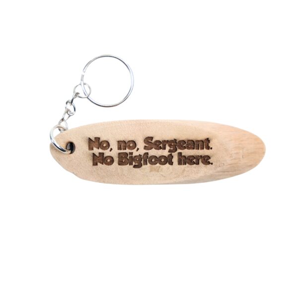 Harry and The Hendersons Driftwood Keychain. “No, no, Sergeant. No Bigfoot here.” front quote and North Bend, WA filming location of Harry and The Hendersons longitude and latitude “47.4957° N, 121.7868° W” on the back.