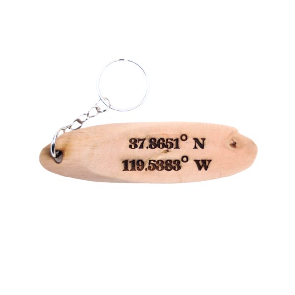 Indiana Jones Driftwood Keychain. “Fortune and glory, kid. Fortune and glory.” front quote and Yosemite National Park filming location of Indiana Jones longitude and latitude “37.8651° N, 119.5383° W” on the back.