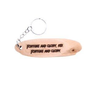 Indiana Jones Driftwood Keychain. “Fortune and glory, kid. Fortune and glory.” front quote and Yosemite National Park filming location of Indiana Jones longitude and latitude “37.8651° N, 119.5383° W” on the back.