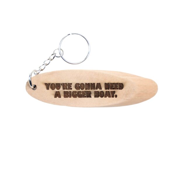 Jaws Driftwood Keychain. “You're gonna need a bigger boat.” front quote and Martha's Vineyard, MA filming location of Jaws longitude and latitude “41.3805° N, 70.6455° W” on the back.