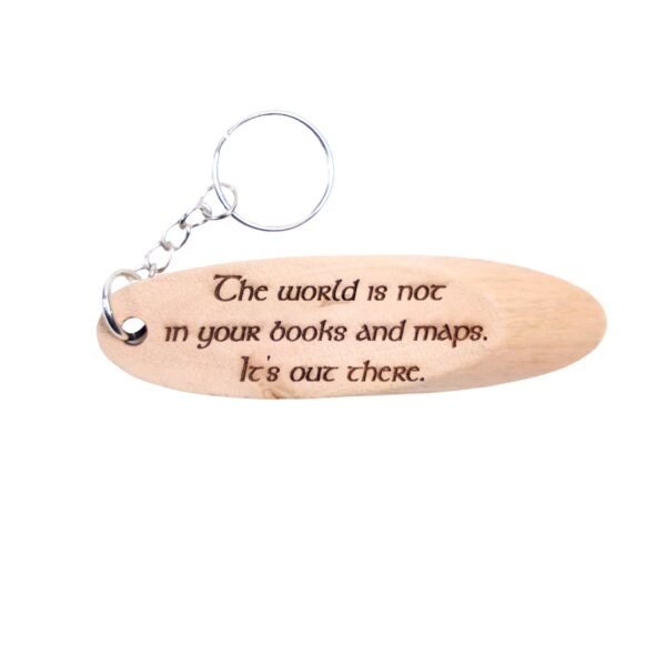 The Shire Hobbit Driftwood Keychain. “The world is not in your books and maps. It's out there.” front quote and Hobbiton, New Zealand filming location of The Shire Hobbit longitude and latitude “37.8721° S, 175.6829° E” on the back.